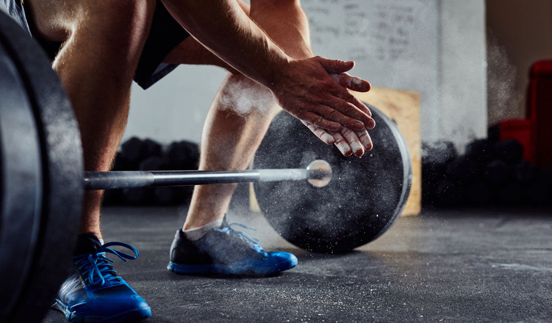 clapping hands before lifting barbell