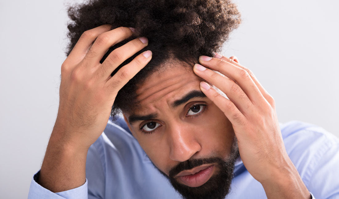 closeup of man examining hair