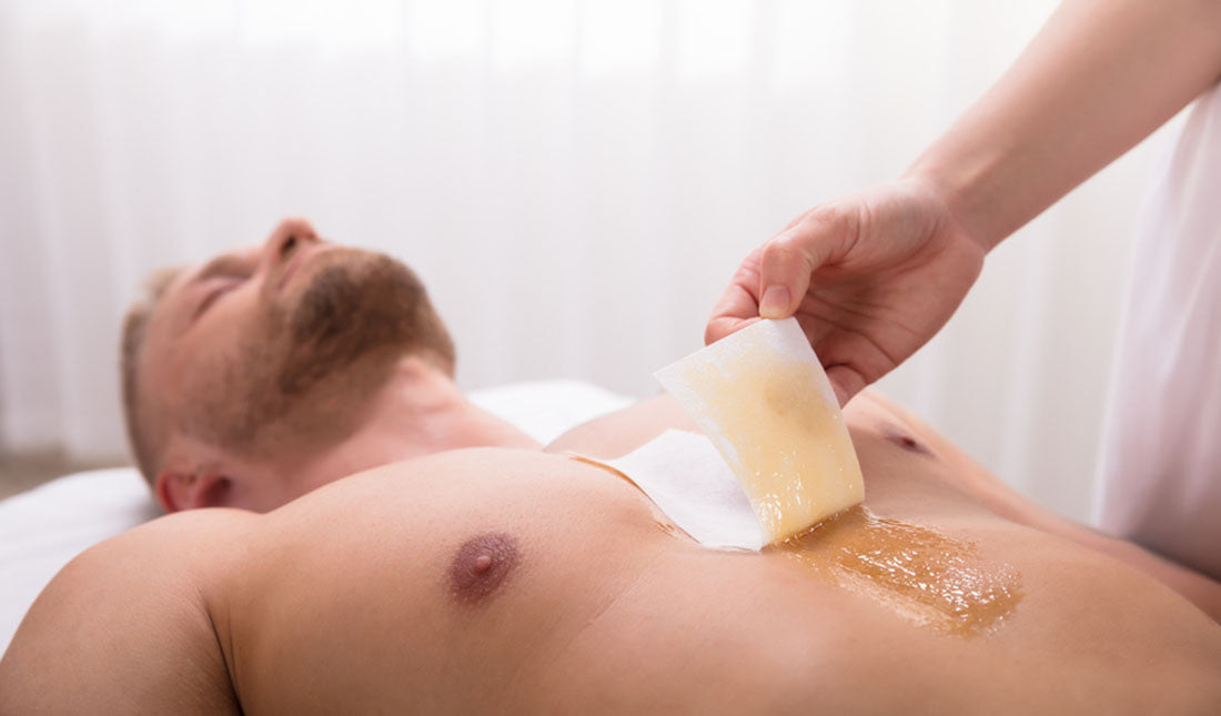 esthetician waxing mans chest