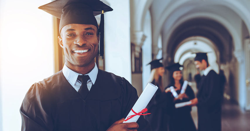 portrait of happy graduate with diploma