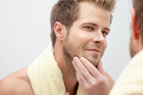 man looking into mirror