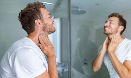 man putting on after shave