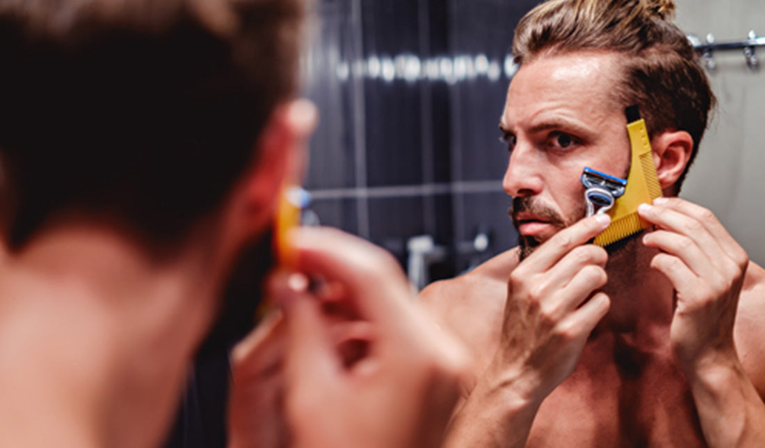 man shaving his beard