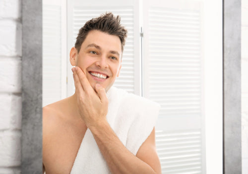 man smiling in mirror