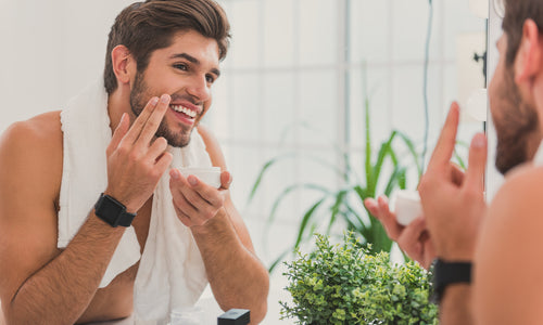 man smiling in mirror