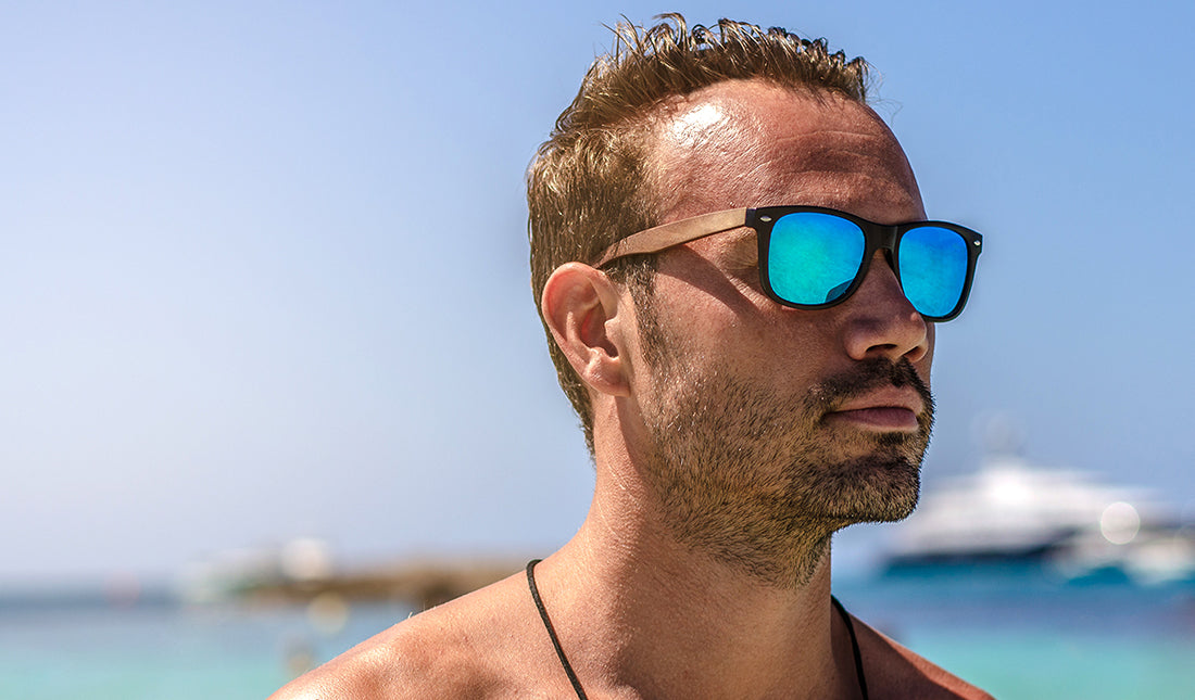 man at the beach wearing sunglasses