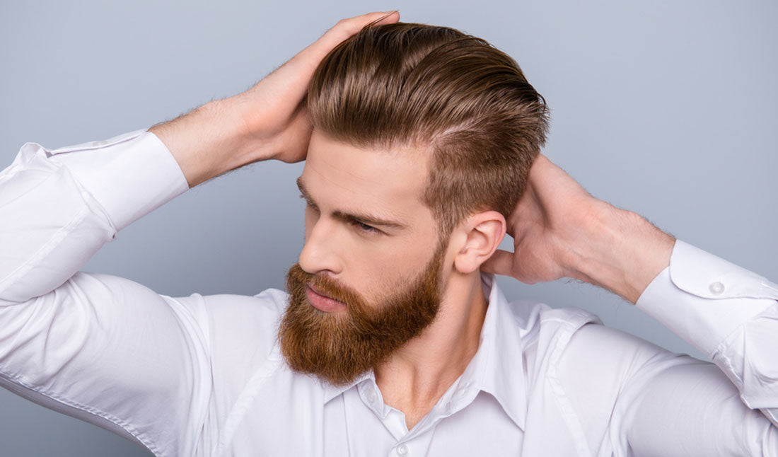 portrait of man touching hair