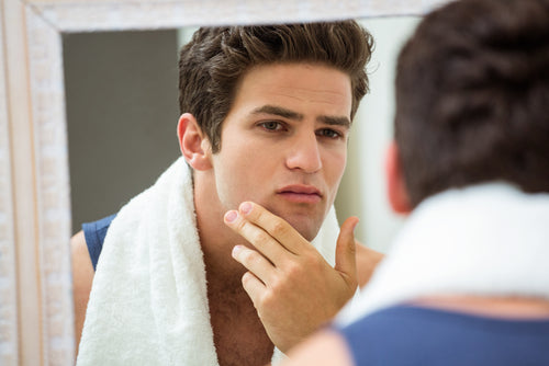 reflection young man in mirror